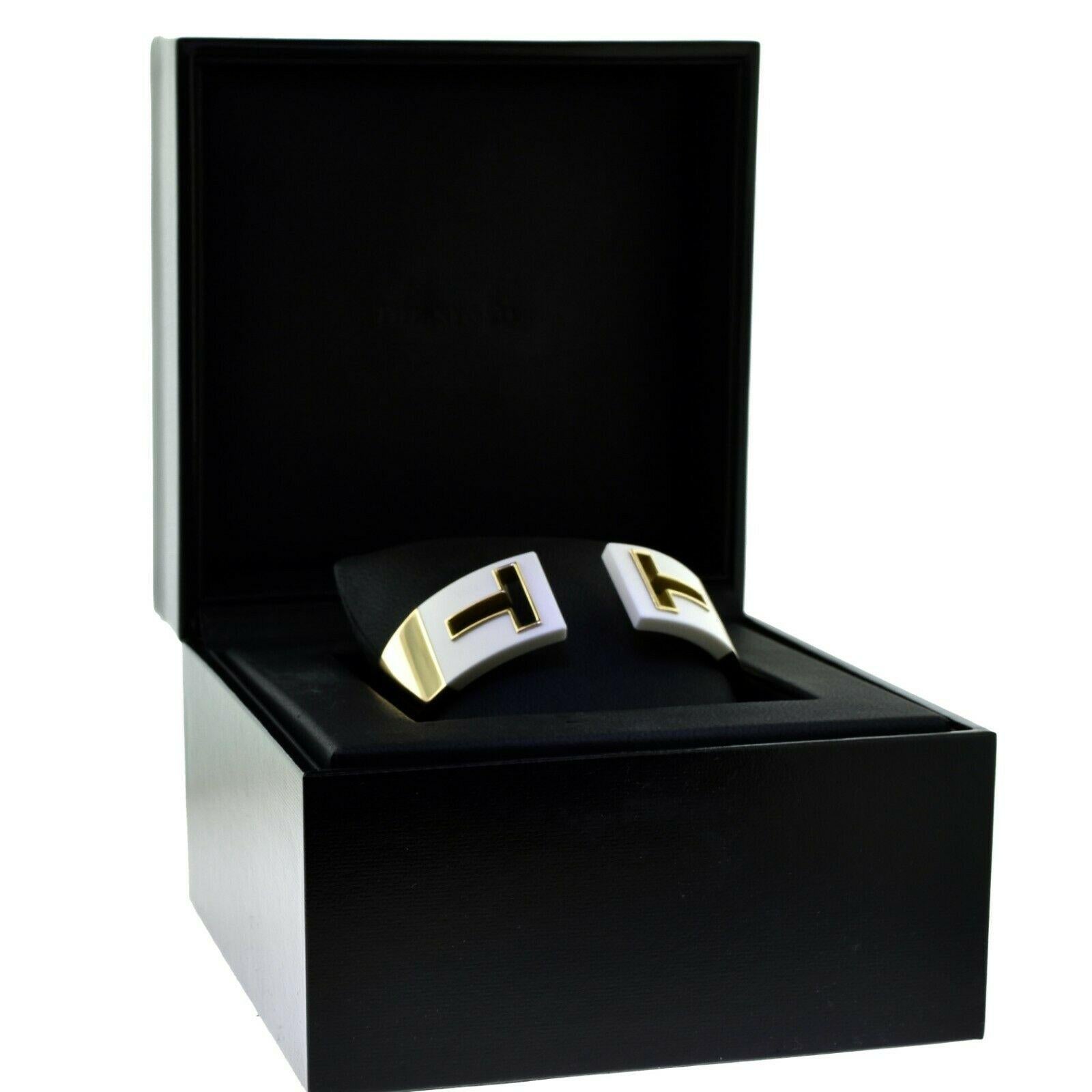 Brilliance Jewels, Miami
Questions? Call Us Anytime!
786,482,8100

Designer: Tiffany & Co.

Collection: Tiffany T 

Style: T Cutout

Metal: Yellow Gold

Metal Purity: 18k

Non-Metal Material: White Enamel 

Total Item Weight (grams):  74.0

Size: