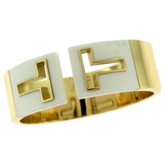 Tiffany & Co. Tiffany T Cut-Out Yellow Gold White Enamel Flexible Bracelet Cuff