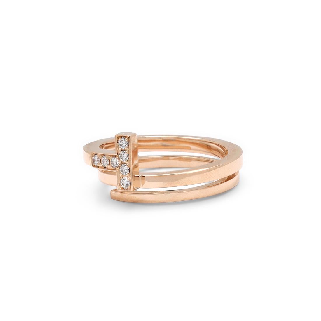 Authentic Tiffany & Co. 'Tiffany T' square wrap ring crafted in 18 karat rose gold and accented with an estimated 0.10 carats of high quality (E-F color, VS clarity) round brilliant cut diamonds. Signed T&Co., Au750, Italy. Ring size 6 1/2 US, 54