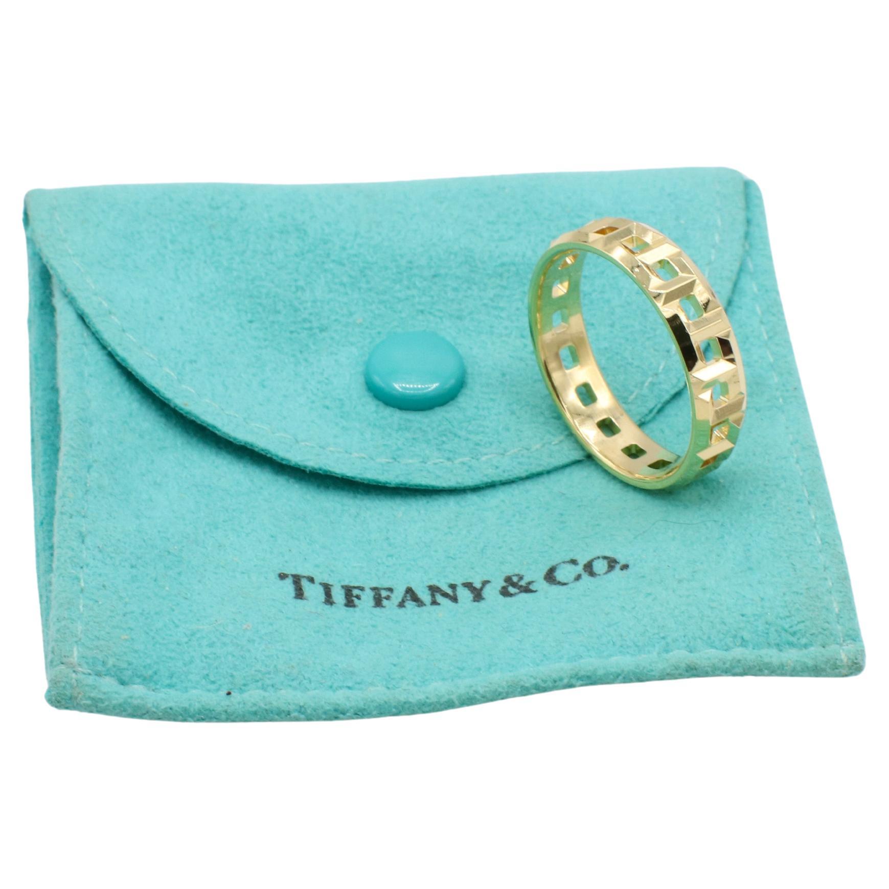 Tiffany & Co. Tiffany T. True 18 Karat Yellow Gold Band Ring 5.5MM
Metal: 18k yellow gold
Weight: 6.43 grams
Width: 5.5mm
Size: 11 (US)
Signed: Tiffany & Co. Au750 ITALY 
Retail: $2,250 USD