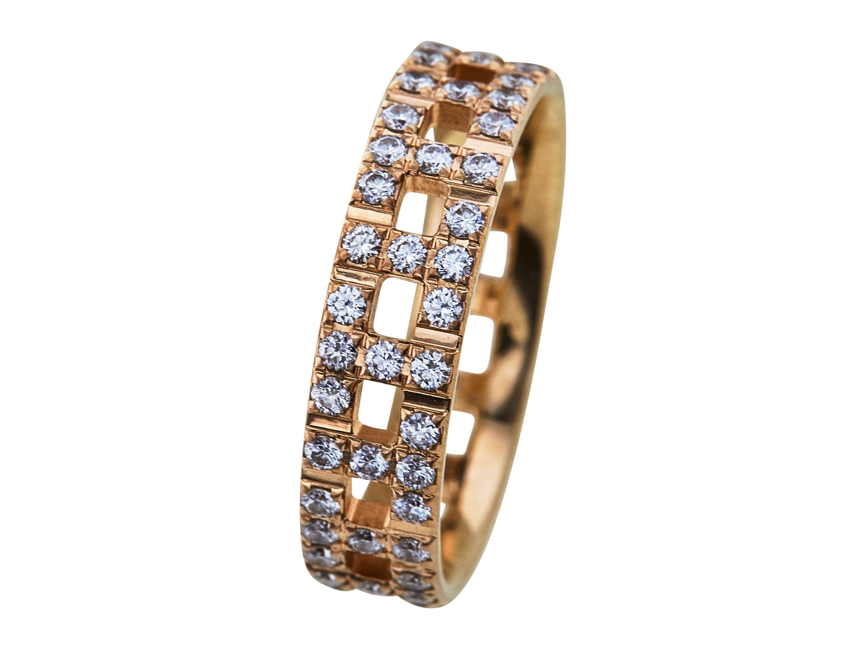 Iconic Tiffany & Co. T True Wide band designed as alternating T links crafted in 18 karat yellow gold and pavé-set with round brilliant cut diamonds weighing an estimated 0.99 carat total weight. Signed Tiffany & Co. 750 Italy. Ring size 8 ½. The