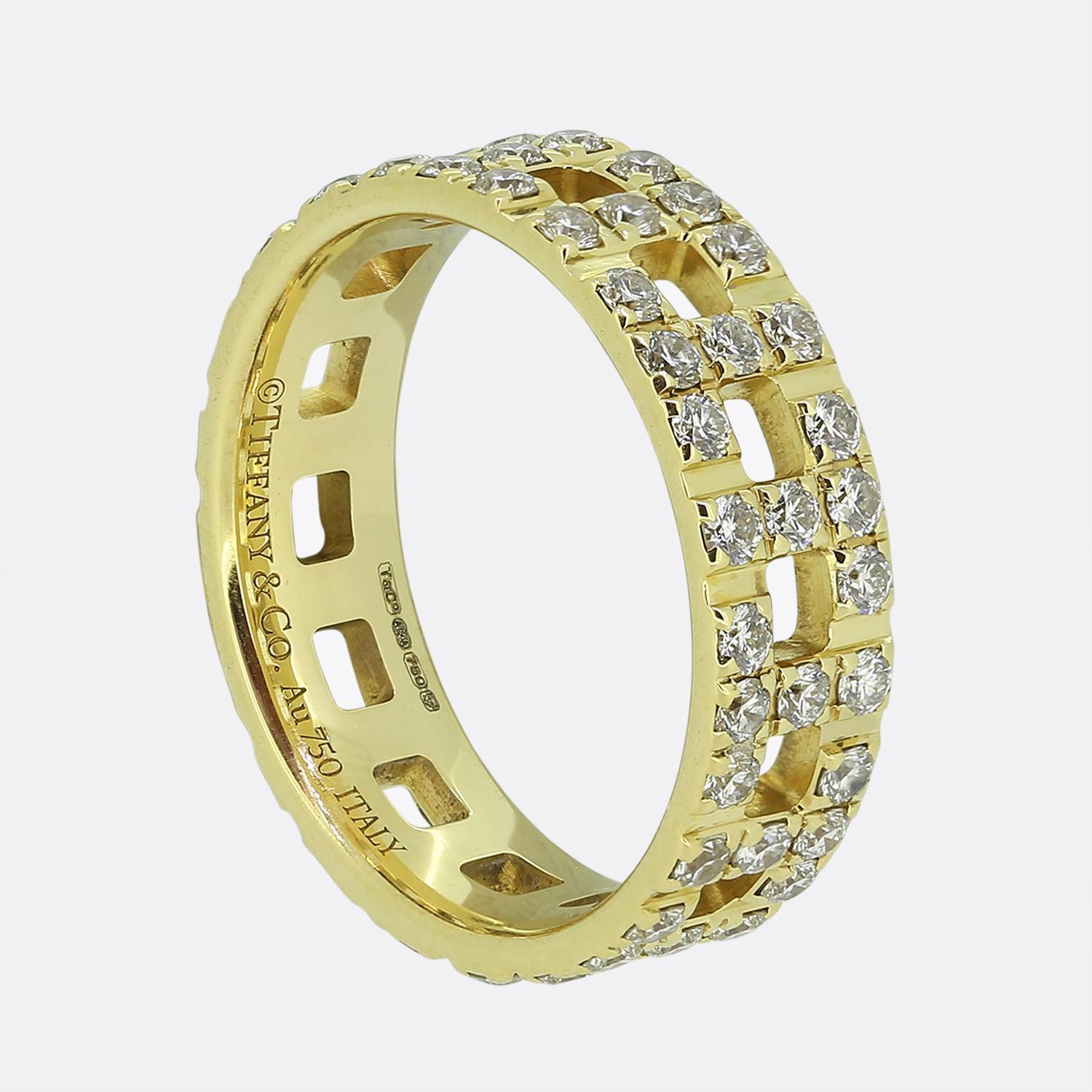 Here we have a fabulous diamond ring from the world renowned jewellery designer, Tiffany & Co. This 18ct yellow gold piece forms part of Tiffany's iconic Tiffany T collection with the signature T motif continuously pavé set around the entire open