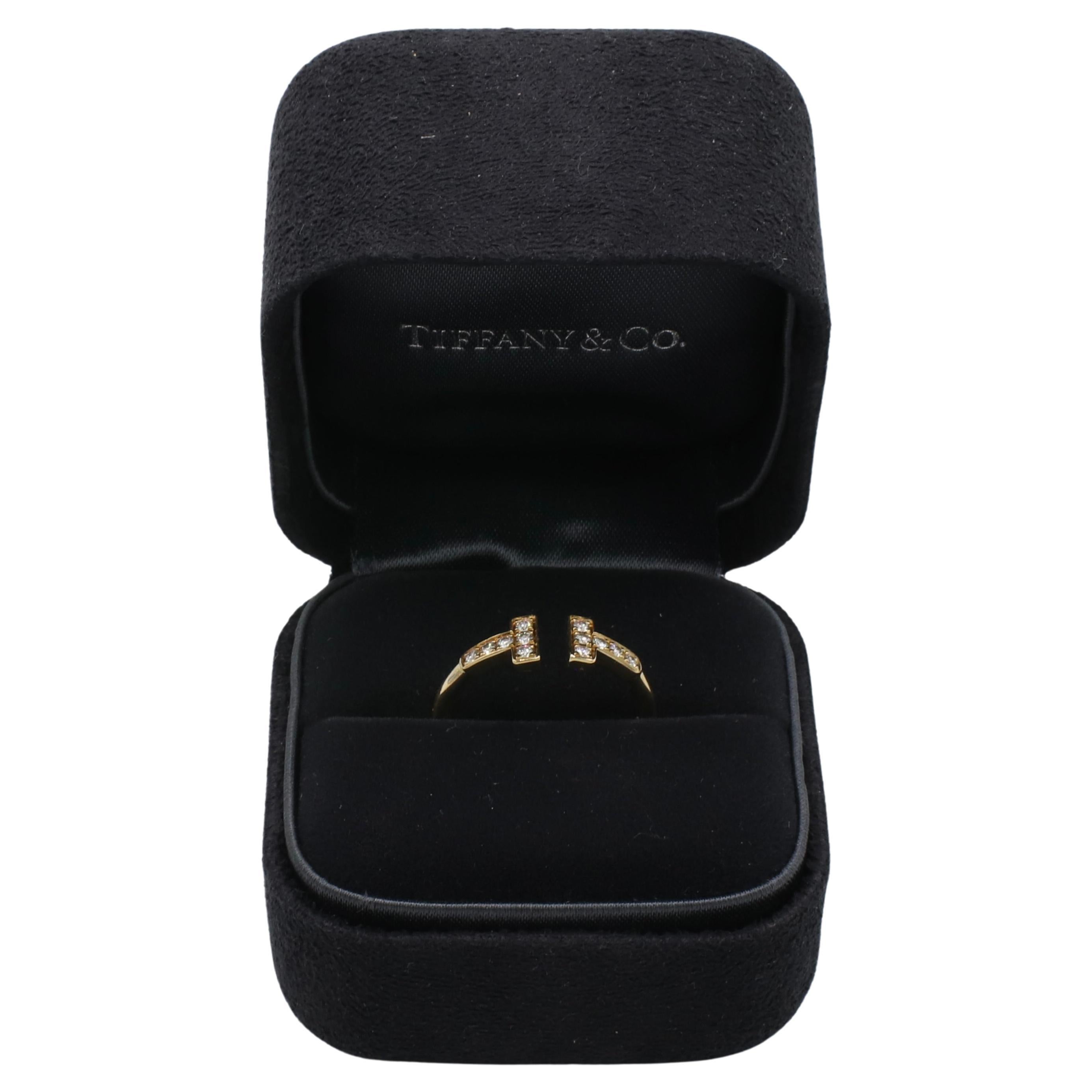 Tiffany & Co. Tiffany T Wire 18 Karat Yellow Gold Natural Diamond Ring 
Metal: 18k yellow gold
Weight: 2.48 grams
Diamonds:  0.13 CTW round natural diamonds F-G VS
Size: 6.5 (US)
Signed: ©T&Co. Au750 ITALY
Retail: $2,675 USD

