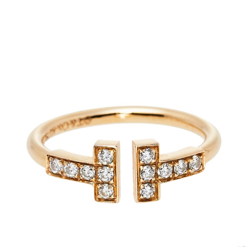 Awe-inspiring and radiating sophistication, this T Wire ring from Tiffany & Co. is a piece that you will always cherish wearing! Crafted from 18K rose gold, it features a wire-like band that carries a diamond studded 'T' at both ends. It has the