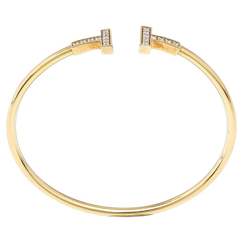 The Tiffany T collection by Tiffany & Co. has been inspired by the city of New York. Each piece comes with a distinct shape that boasts fabulous style and structure. This T Wire bracelet is crafted from 18K yellow gold and styled as a wire-like band
