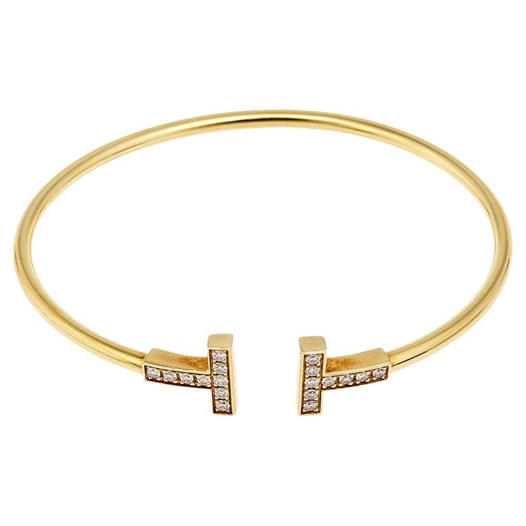 Tiffany and Co. Tiffany Bracelet manchette ouvert en or jaune 18 carats  avec fil en T et diamants sur 1stDibs