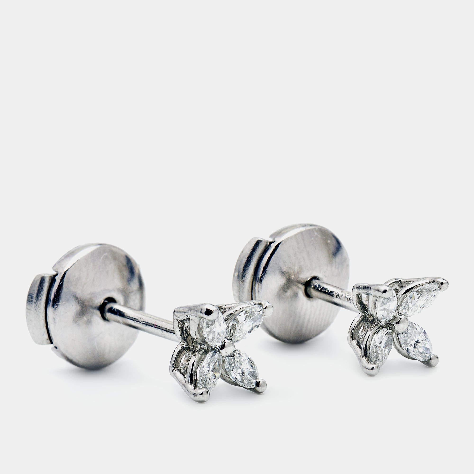 The Tiffany & Co. Tiffany Victoria earrings are exquisite and timeless pieces of jewelry. Crafted in lustrous platinum, these stud earrings feature a cluster of dazzling diamonds in the iconic Victoria design, creating a sparkling and elegant look.