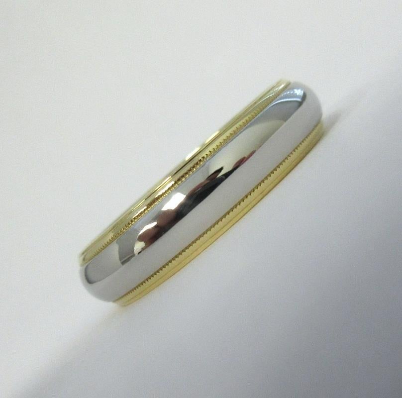 TIFFANY & Co. Together Platinum 18K Gold 6mm Milgrain Wedding Band Ring 13

Metal: Platinum and 18K Yellow Gold
Size: 13
Band Width: 6mm
Weight: 11.30 grams 
Hallmark: ©TIFFANY&CO. 750 PT950
Condition: Excellent condition, like new

Authenticity