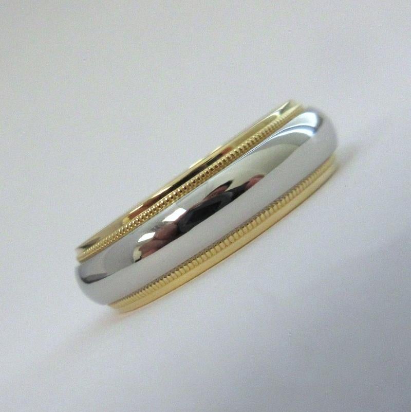 TIFFANY & Co. Together Platinum 18K Gold 6mm Milgrain Wedding Band Ring 8.5

Metal: Platinum and 18K Yellow Gold
Size: 8.5
Band Width: 6mm
Weight: 10.0 grams 
Hallmark: TIFFANY&CO. 750 PT950
Condition: Excellent condition, like new
Tiffany price: