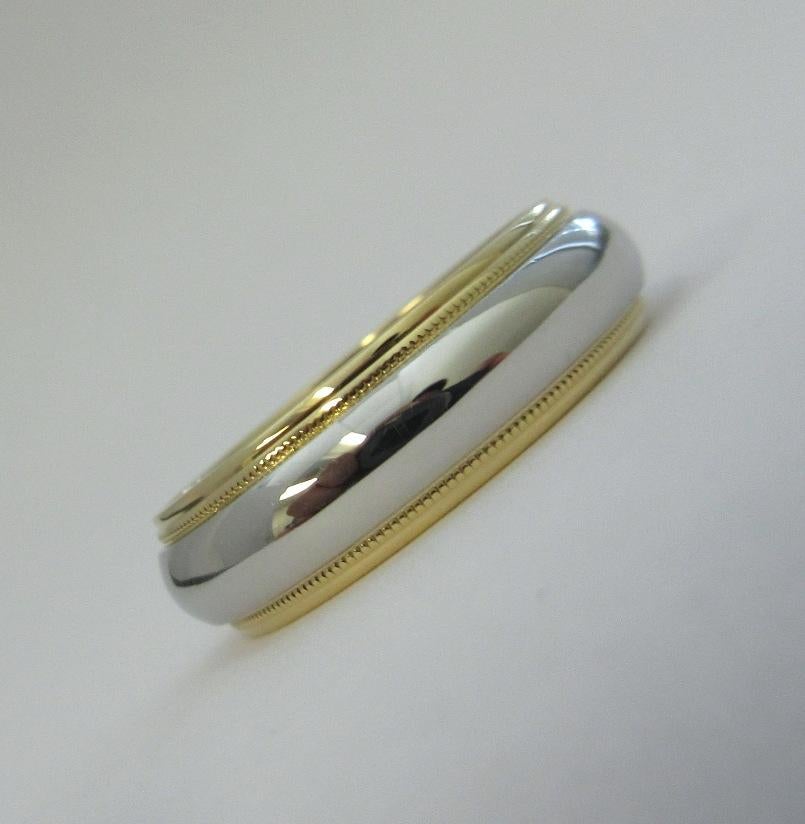TIFFANY & Co. Together Platinum 18K Yellow Gold 6mm Milgrain Wedding Band Ring 8

Metal: Platinum and 18K Yellow Gold
Size: 8
Band Width: 6mm
Weight: 8.50 grams 
Hallmark: TIFFANY&CO. 750 PT950
Condition: Excellent condition
Tiffany Retail Price: