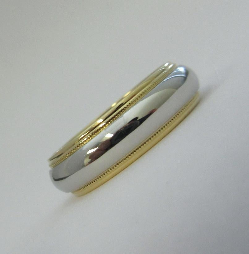 TIFFANY & Co. Together Platinum 18K Yellow Gold 6mm Milgrain Wedding Band Ring 8

Metal: Platinum and 18K Yellow Gold
Size: 8
Band Width: 6mm
Weight: 9.70 grams 
Hallmark: TIFFANY&CO. 750 PT950
Condition: Excellent condition

Authenticity Guaranteed