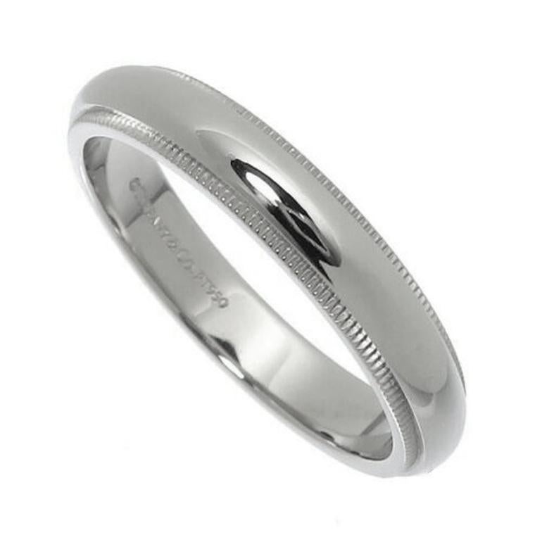 TIFFANY & Co. Together Platinum 4mm Milgrain Wedding Band Ring 10

Metal: Platinum
Size: 10 
Band Width: 4mm
Weight: 9.50 grams
Hallmark: ©TIFFANY&Co. PT950
Condition: Excellent condition, like new
Tiffany Price: $2,100

Authenticity Guaranteed 