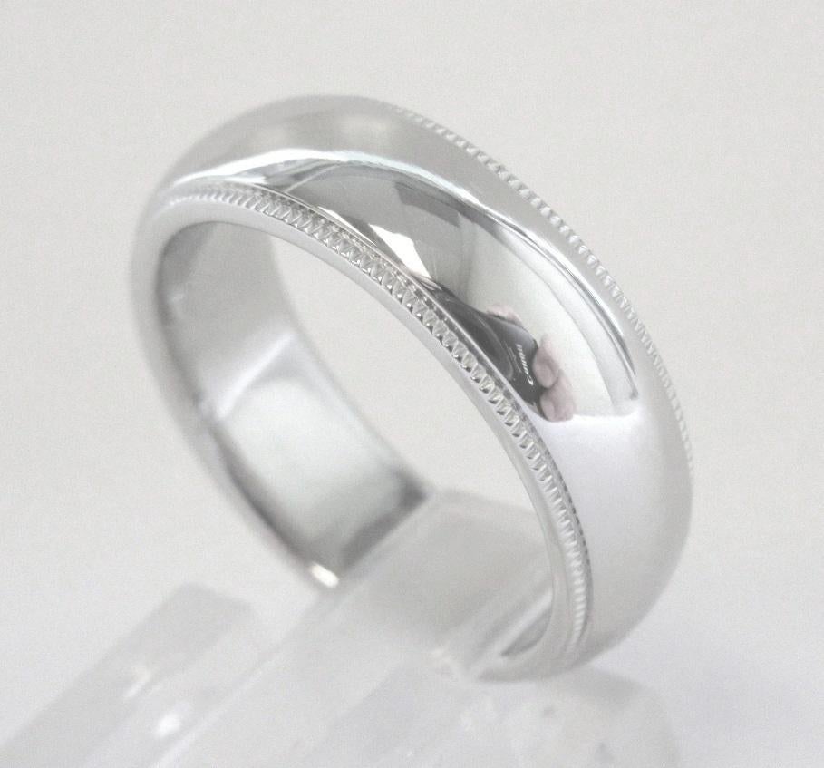 TIFFANY & Co. Together Platinum 6mm Milgrain Wedding Band Ring 6

 Metal: Platinum 
 Size: 6 
 Band Width: 6mm
 Weight: 12.50 grams
 Hallmark: TIFFANY&CO. PT950
 Condition: Excellent condition

Authenticity Guaranteed