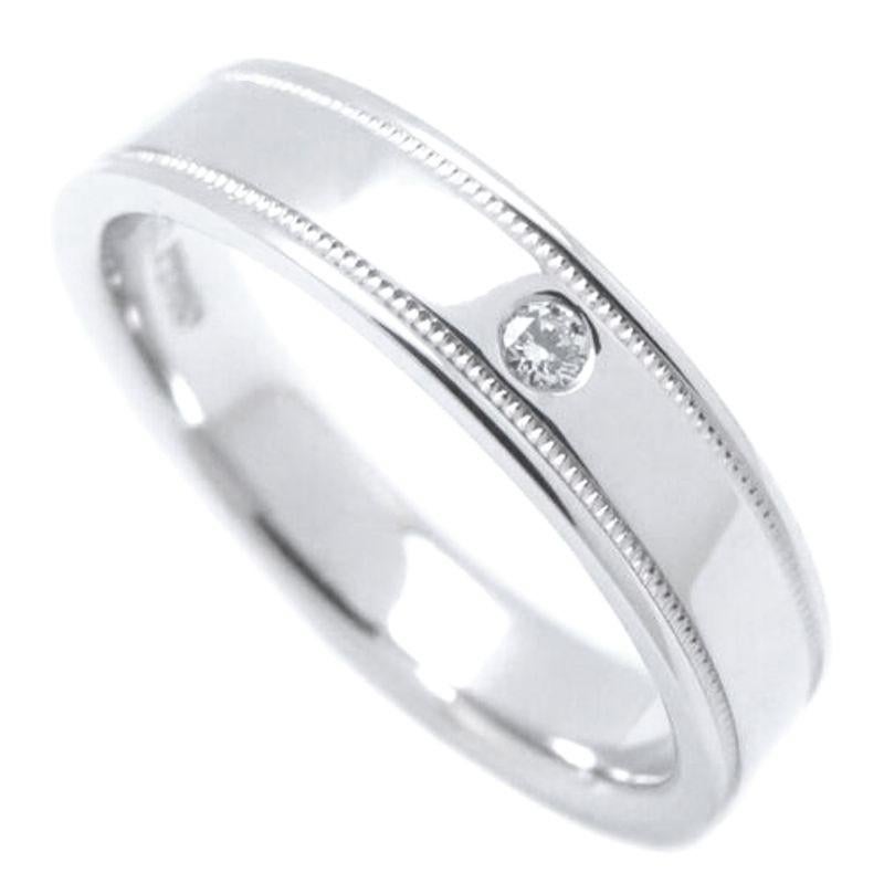TIFFANY & Co. Together Platinum Diamond 4mm Double Milgrain Band Ring 8

 Metal: Platinum 
 Size: 8 
 Band Width: 4mm
 Weight: 7.10 grams
 Diamond: One round brilliant diamond, carat total weight .01
 Hallmark: ©TIFFANY&CO. PT950 
 Condition: