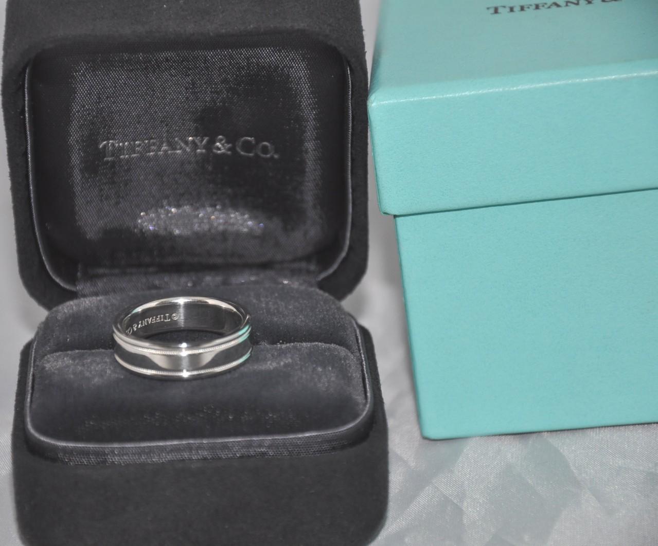 TIFFANY & Co. Together Platinum 6mm Double Milgrain Wedding Band Ring 9

 Metal: Platinum 
 Size: 9 
 Band Width: 6mm
 Weight: 13.20 grams
 Hallmark: ©TIFFANY&CO. PT950 
 Condition: Excellent condition, like new, comes with Tiffany box 
 Tiffany