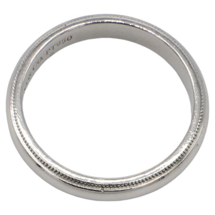 Tiffany & Co. Together Platinum Milgrain 4MM Wedding Band Ring 
Metal: Platinum
Weight: 8.24 grams
Width: 4mm
Size: 8.5 (US)
Signed: ©Tiffany & Co. PT950
Retail: $2,100 USD
SAT F35000723