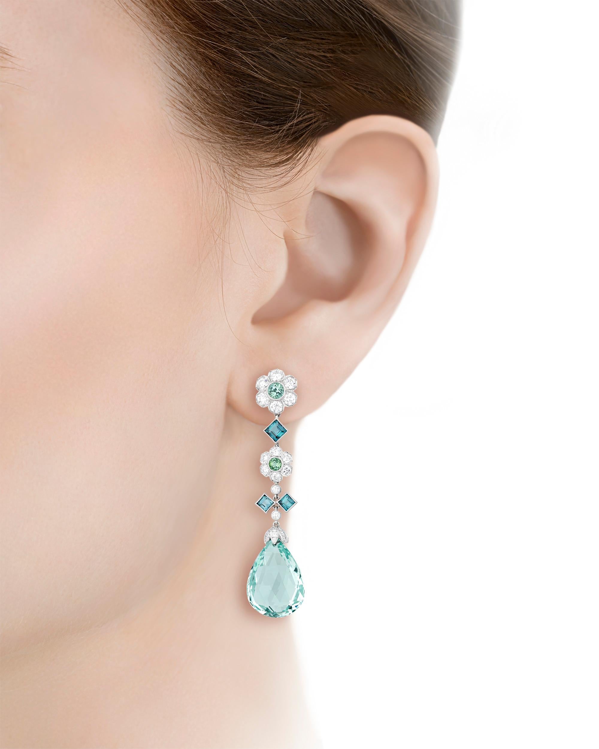 These scintillating Tiffany & Co. earrings present tourmalines possessing radiant shades of blue and green. The faceted tourmaline drops display the firm’s iconic “Tiffany Blue” hue and weigh a combined 19 carats. Additional round and square-cut