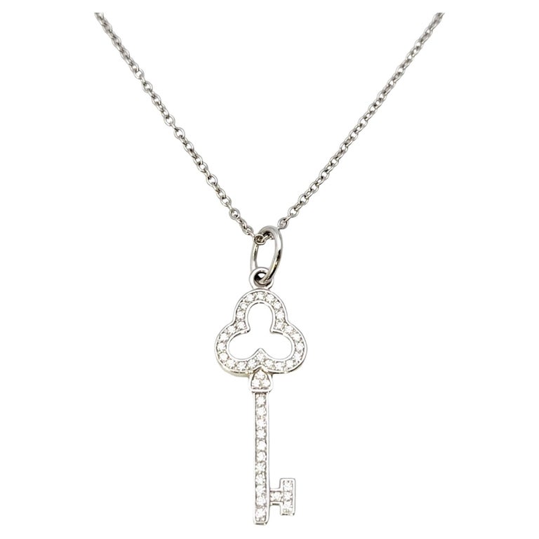 Tiffany Keys modern keys open round key pendant in 18k gold with diamonds,  mini.