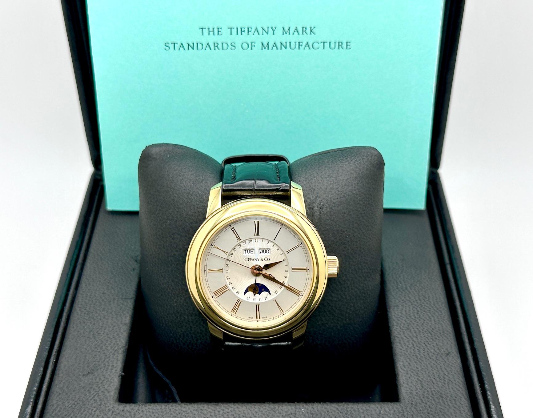 Style Number: 17042084



Year: 2002

 

Model: Tiffany & Co. Mark Moonphase Triple Calendar Watch

 

Case Material: 18K Yellow Gold

 

Band: Black Leather

 

Bezel: 18K Yellow Gold 



Weight: 99.6 Grams

 

Dial: Silver

 

Crystal: Sapphire