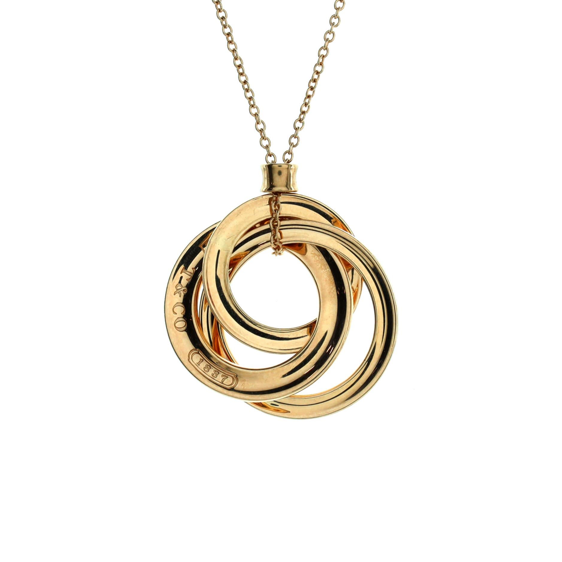Tiffany & Co. Dreifache Kreis-Halskette mit Anhänger aus 18 Karat Gelbgold Damen