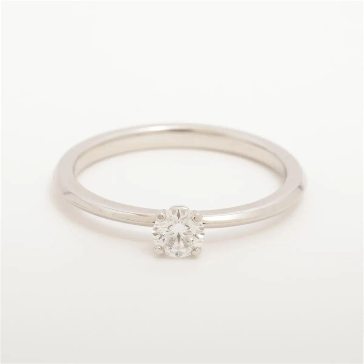 The Tiffany & Co. True Diamond Ring in platinum is a sleek and contemporary take on classic elegance. Crafted from lustrous platinum, it features a brilliant diamond at the center, secured in a refined geometric setting that highlights the stone’s