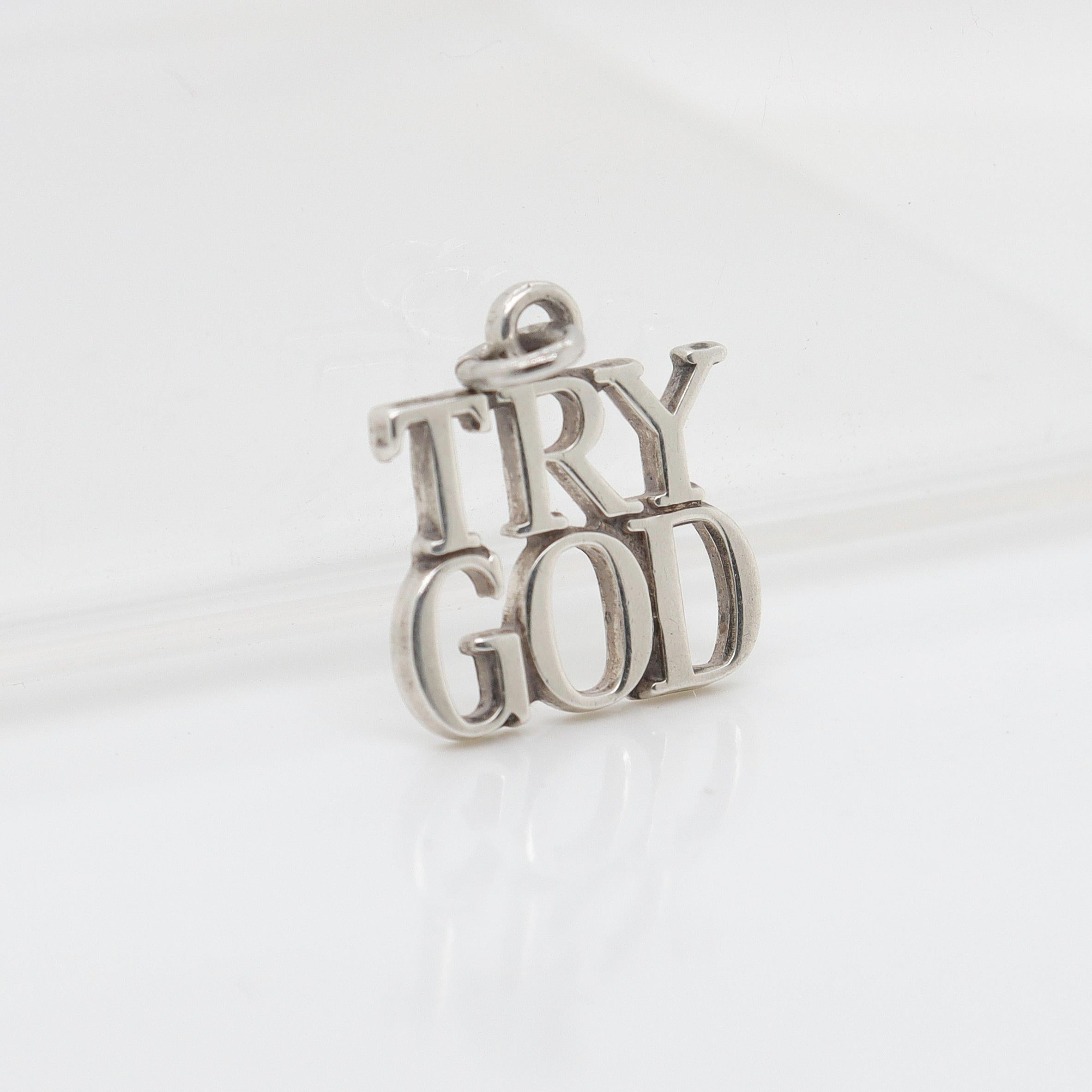A fine silver pendant or charm.

By Tiffany & Co.

In sterling silver.

In the form of the words 