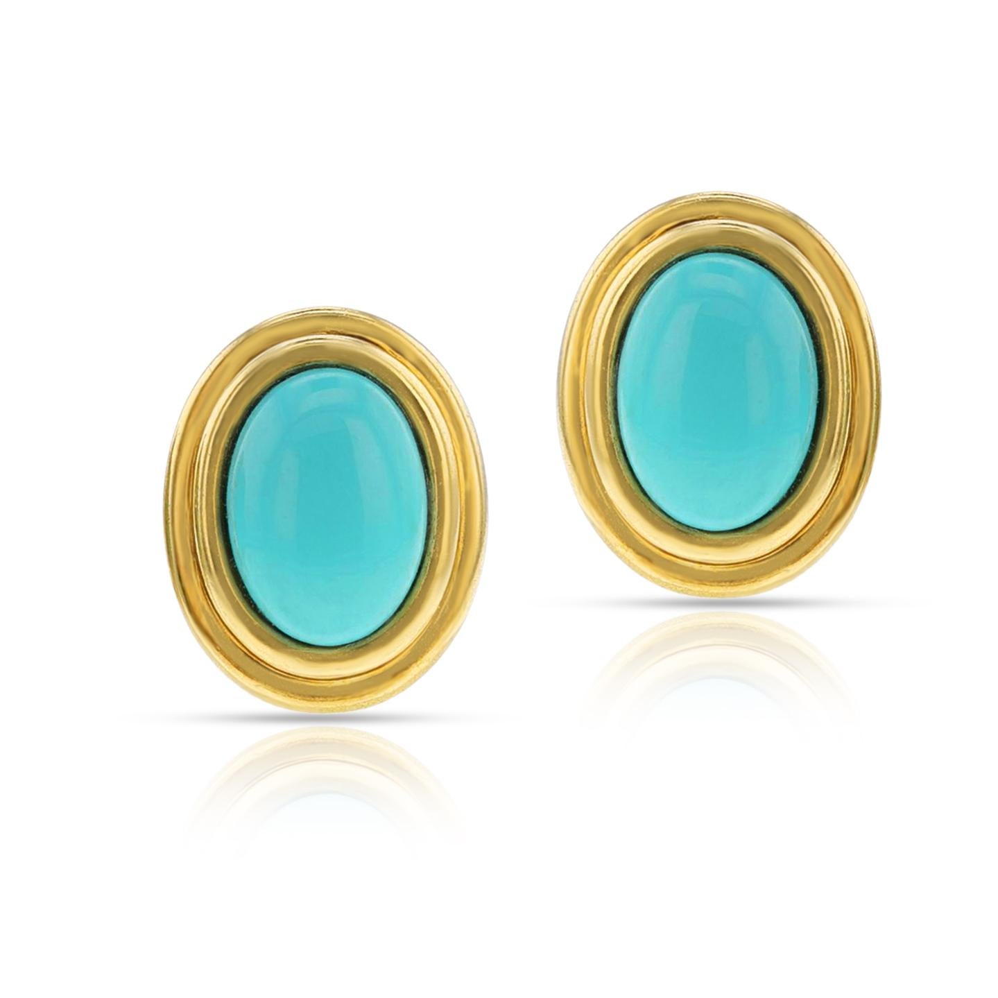 A pair of Tiffany & Co. Turquoise Cabochon and Gold Earrings made in 18K. The turquoise cabochon dimensions are 14 x 10 MM. The length is is 0.80 inches. Stamped. The total weight is 12.64 grams.