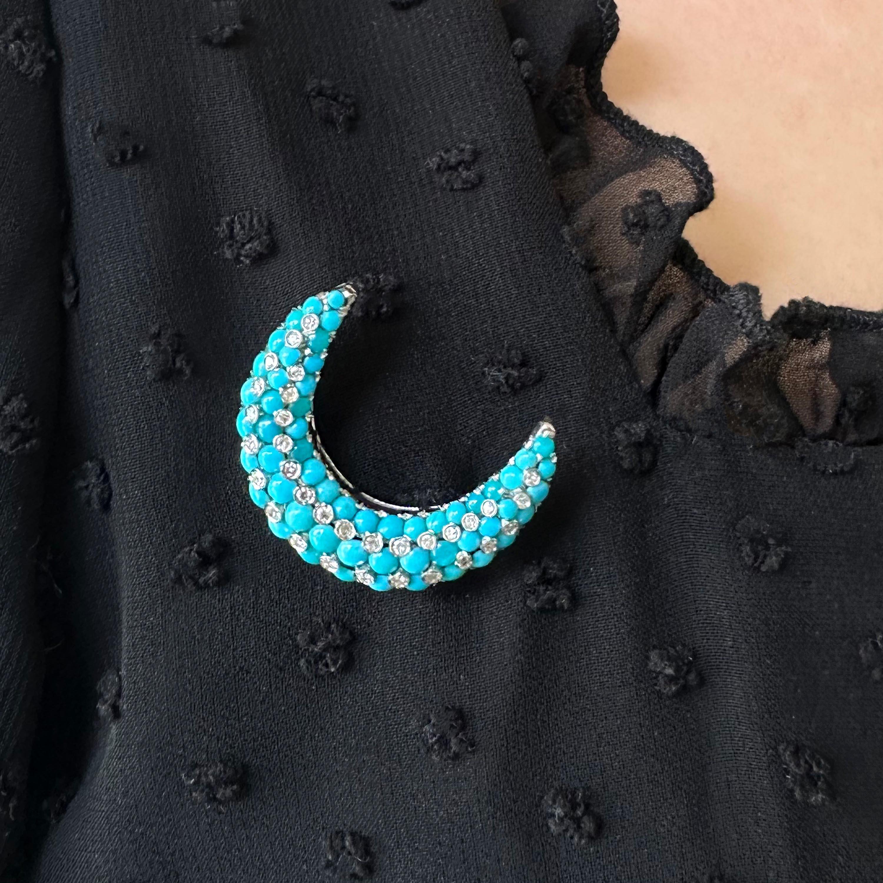 A vintage Tiffany & Co. turquoise, diamond and white gold crescent brooch, set with three rows of graduating, cabochon-cut turquoise, interspersed with eight-cut diamonds, with an approximate total weight of 0.30ct, in spitched, bezel settings, with