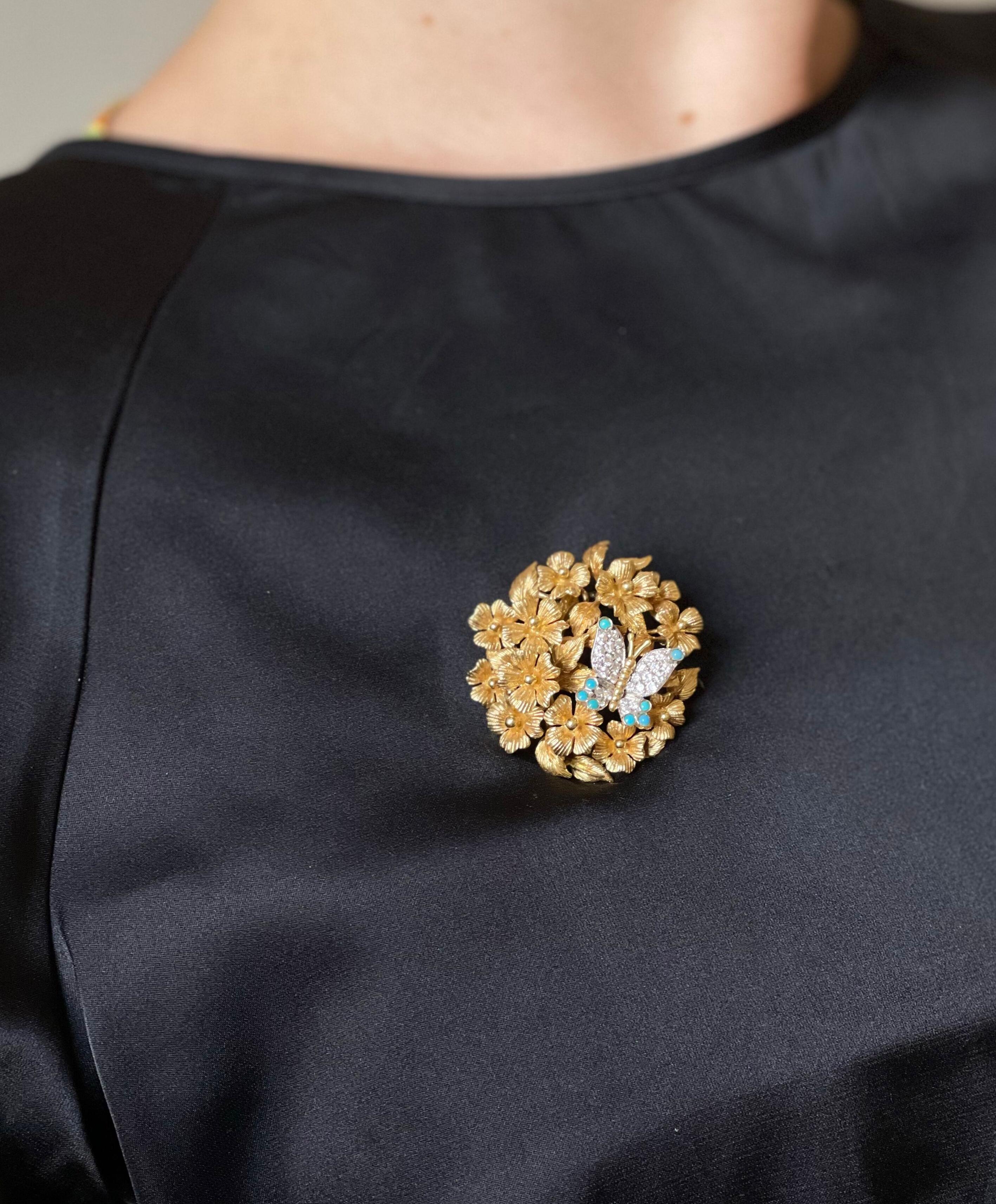 Adorable 18k gold flowers brooch by Tiffany & Co, with platinum butterfly, adorned with turquoise and approx. 0.28ctw in G/VS diamonds. Brooch measures 1.5