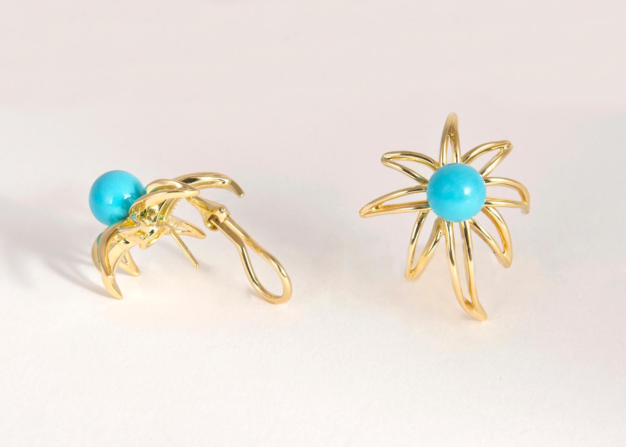 A Tiffany & Co. classic. The fireworks collection is rarely offered with turquoise. Approximately 1 inch in size.