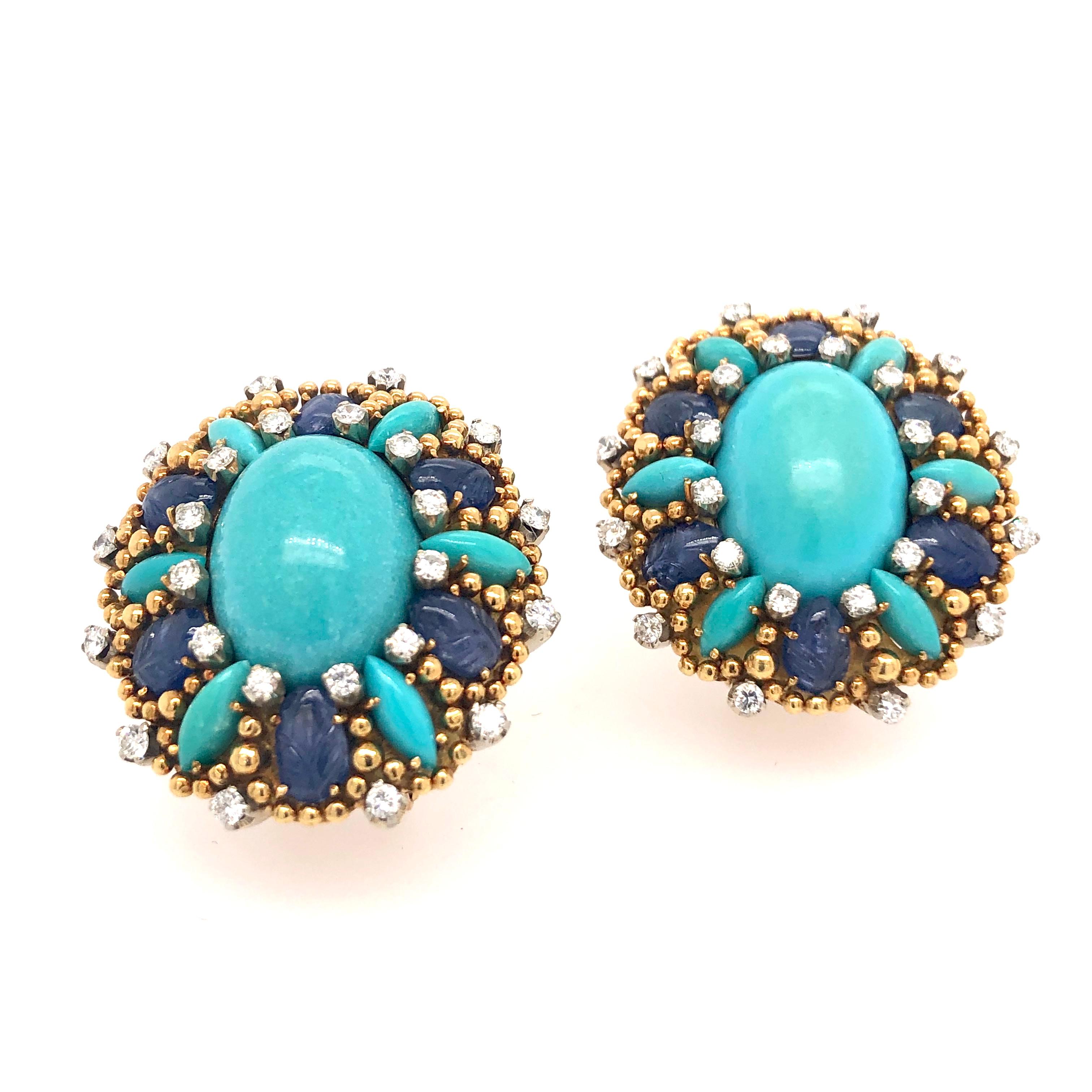 A beautiful specimen of craftsmanship and artistry these turquoise, sapphire, and diamond earrings from Tiffany & Co. are made to impress. The details go all the way into the sapphires which are carved with a floral motif. The stones are set into