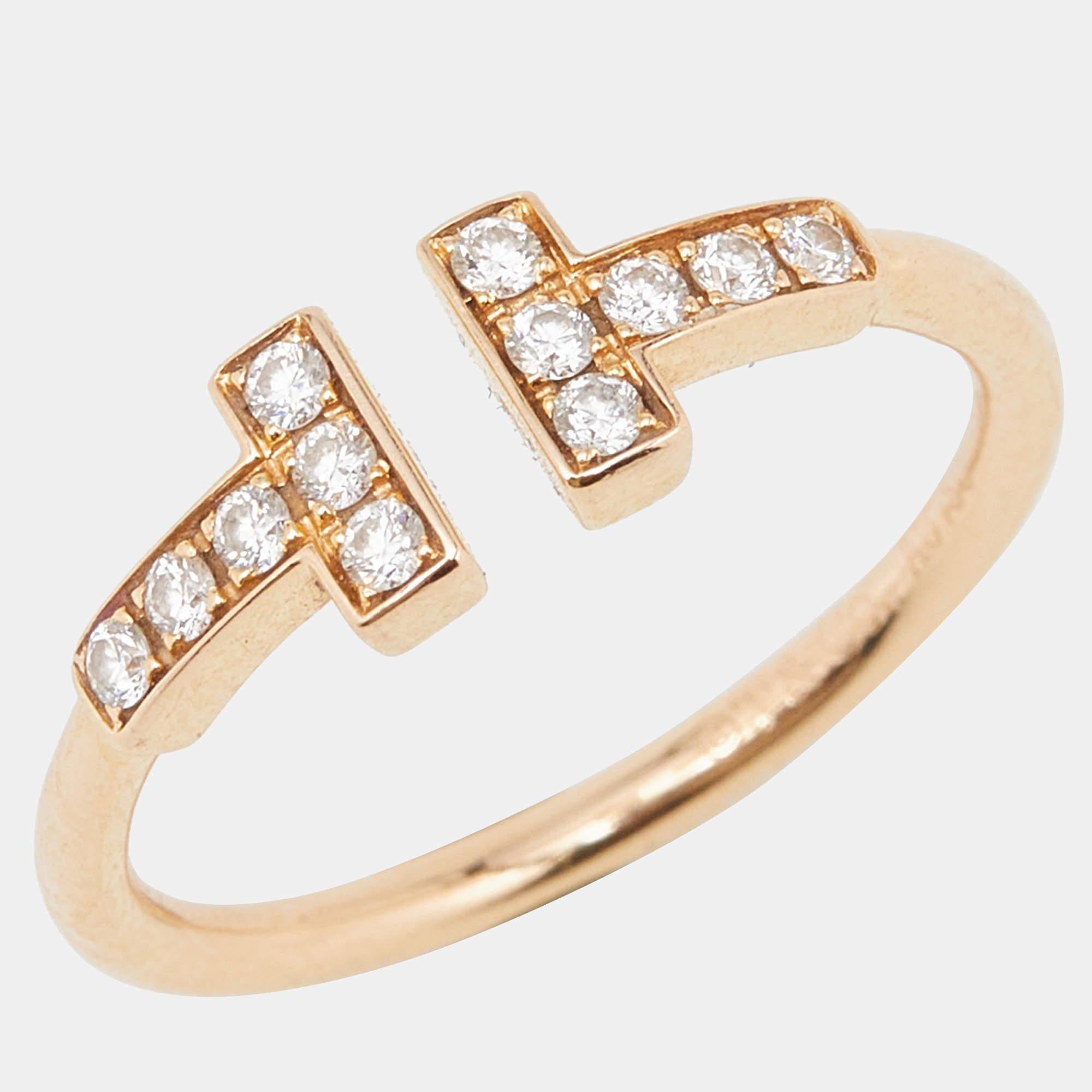 Elevate your style with the timeless elegance of the Tiffany & Co. Twire ring. Crafted with exquisite attention to detail, this stunning piece features a delicate intertwining design adorned with shimmering diamonds, showcasing luxury and
