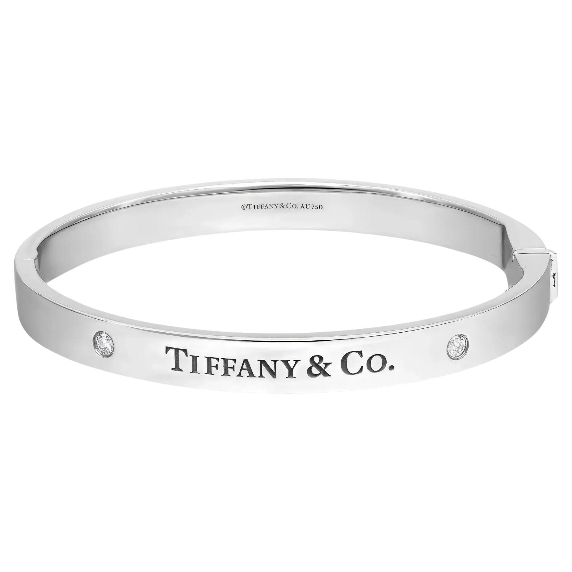 Tiffany & Co. Two Diamond Logo Hinged Bangle Bracelet 18K White Gold Size Medium For Sale
