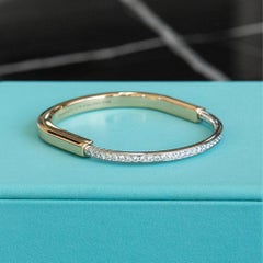 Tiffany & Co. Two Tone Bangle With Half Diamond Pave