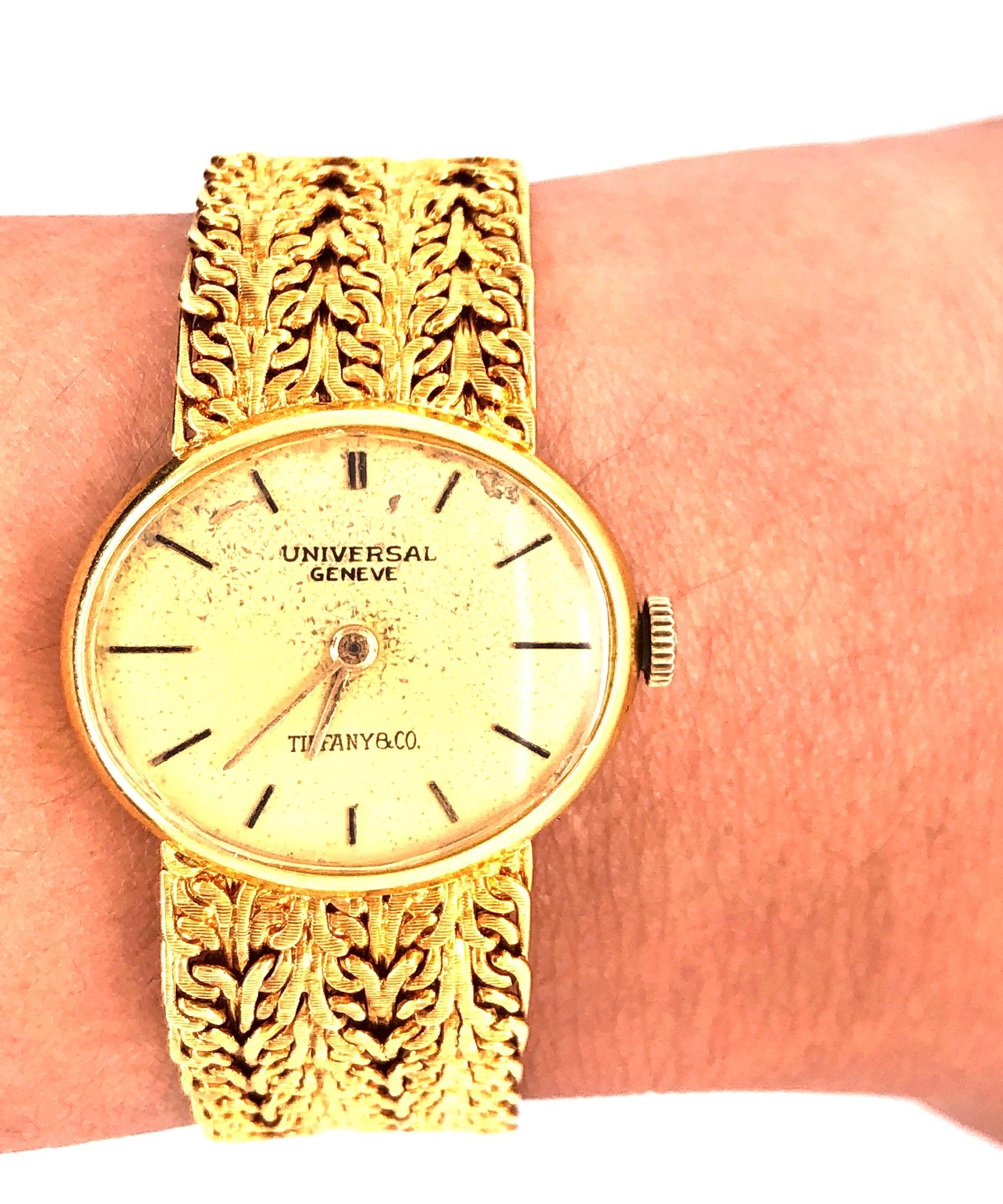 Tiffany & Co Attributed Stamped Ladies Universal Geneve 18 Karat Gold Watch and Band. Having an impressive 41.7 grams of 18Kt gold. Unadjusted 17 Jewels. This watch is presently working. This is a preowned item that can use a bit of cleaning. 
Lia
