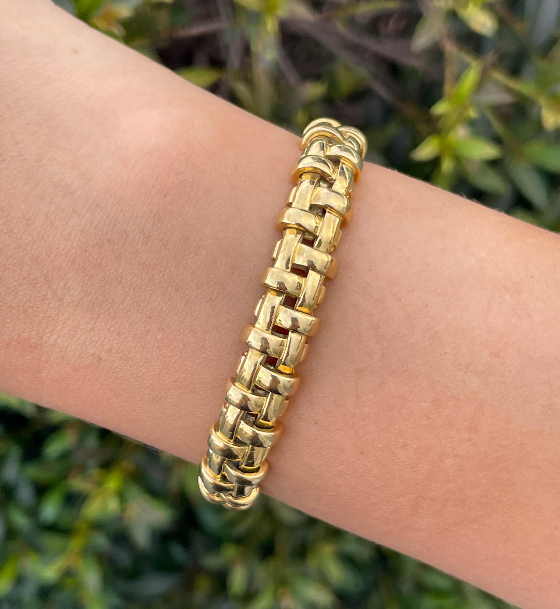 Tiffany & Co Vanerie 18k Yellow Gold Bracelet 
The bracelet is 7 inches long and 9mm wide.
Total weight of the bracelet is 46.1 grams.
Hallmarks: 2002, T&CO, 750, ITALY.

Please view our photos and videos for more details.

Comes with a gift box