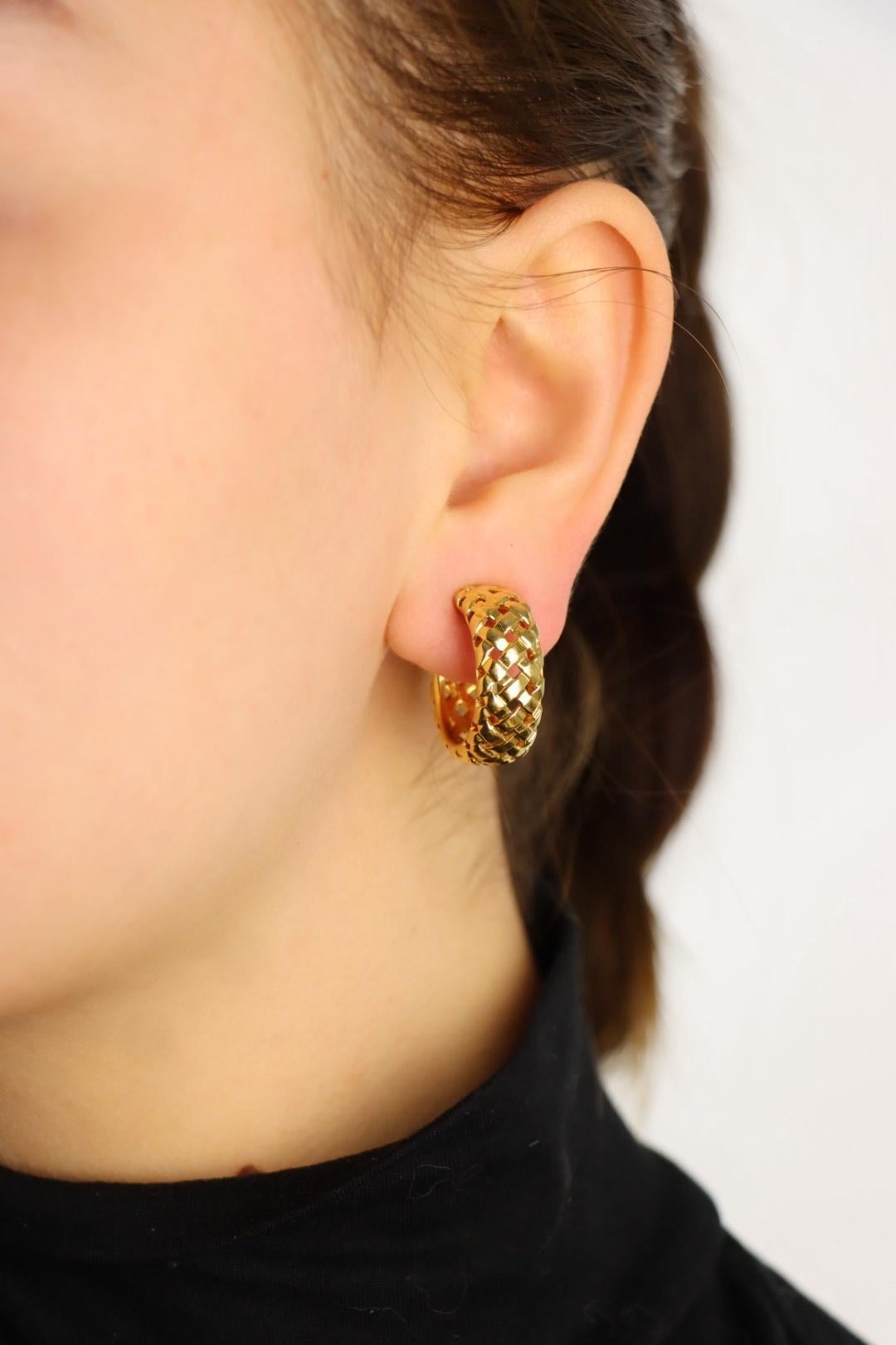 Tiffany & Co. Vannerie 18k Gold Woven Hoop Earrings

Marked:
T&Co.
750

Approximate Dimensions:
2.2 cm (Length) 
0.8 cm (Width)
17.4 grams in weight.