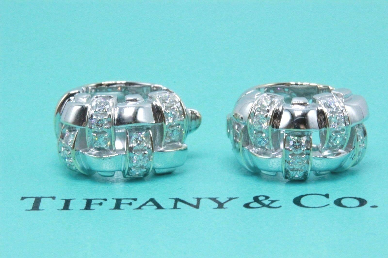 Tiffany & Co.
Style: Vannerie Basket Weave Diamond Earrings
Backing:  Paddle backs with Posts
Metal:  18kt White Gold
Dimensions:  15 X 9 X 11.3 MM
Total Carat Weight:  0.48 CTS
Diamond Shape:  Round Brilliant Diamonds
Diamond Color & Clarity:  G -