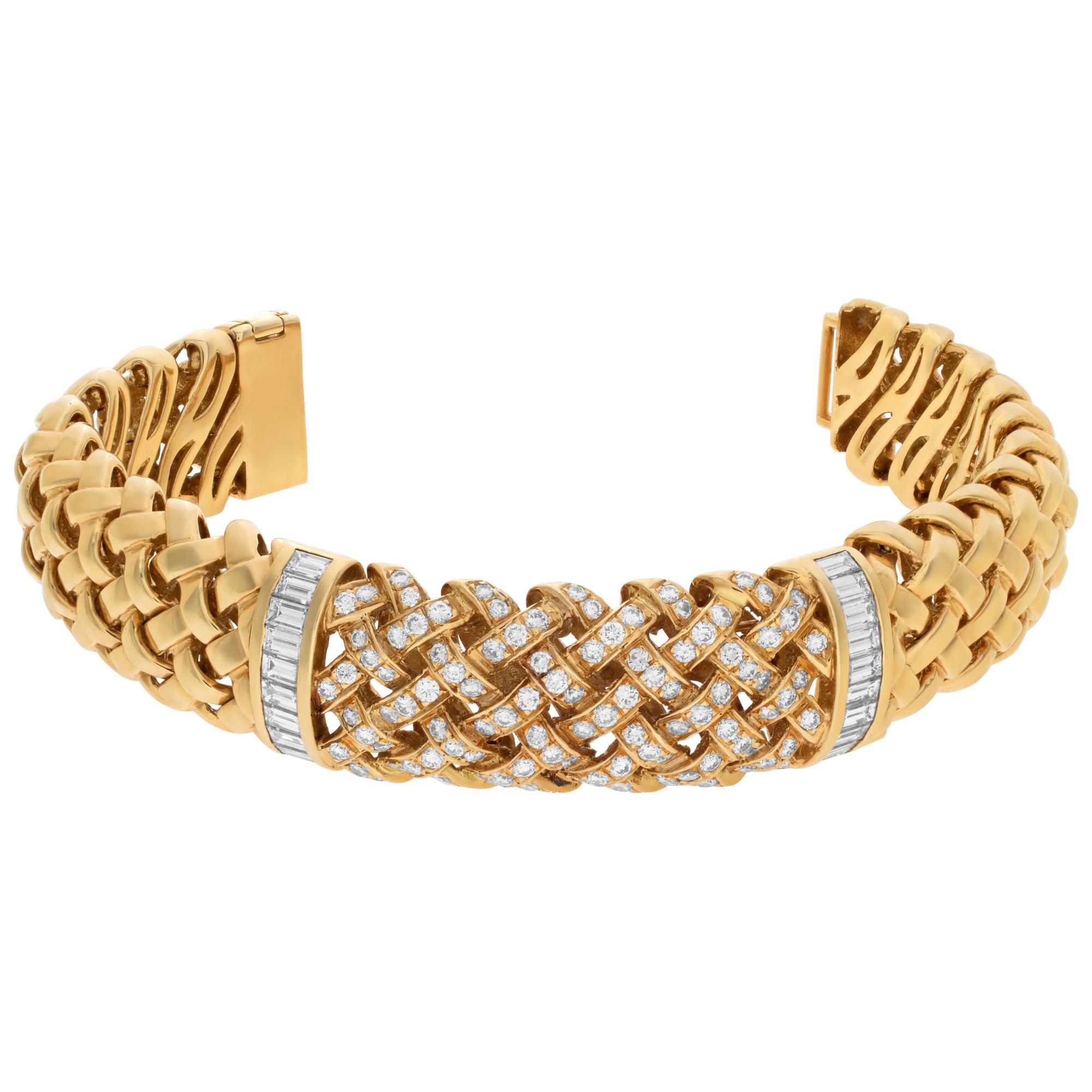 Tiffany & Co. Vannerie collection bracelet in 18K yellow gold. Woven link bracelet in polished 18k yellow gold with approximately 3 carats full round brilliant and baguette cut diamonds estimating F-G color, VVS clarity. 16 mm width x 8 inch.
