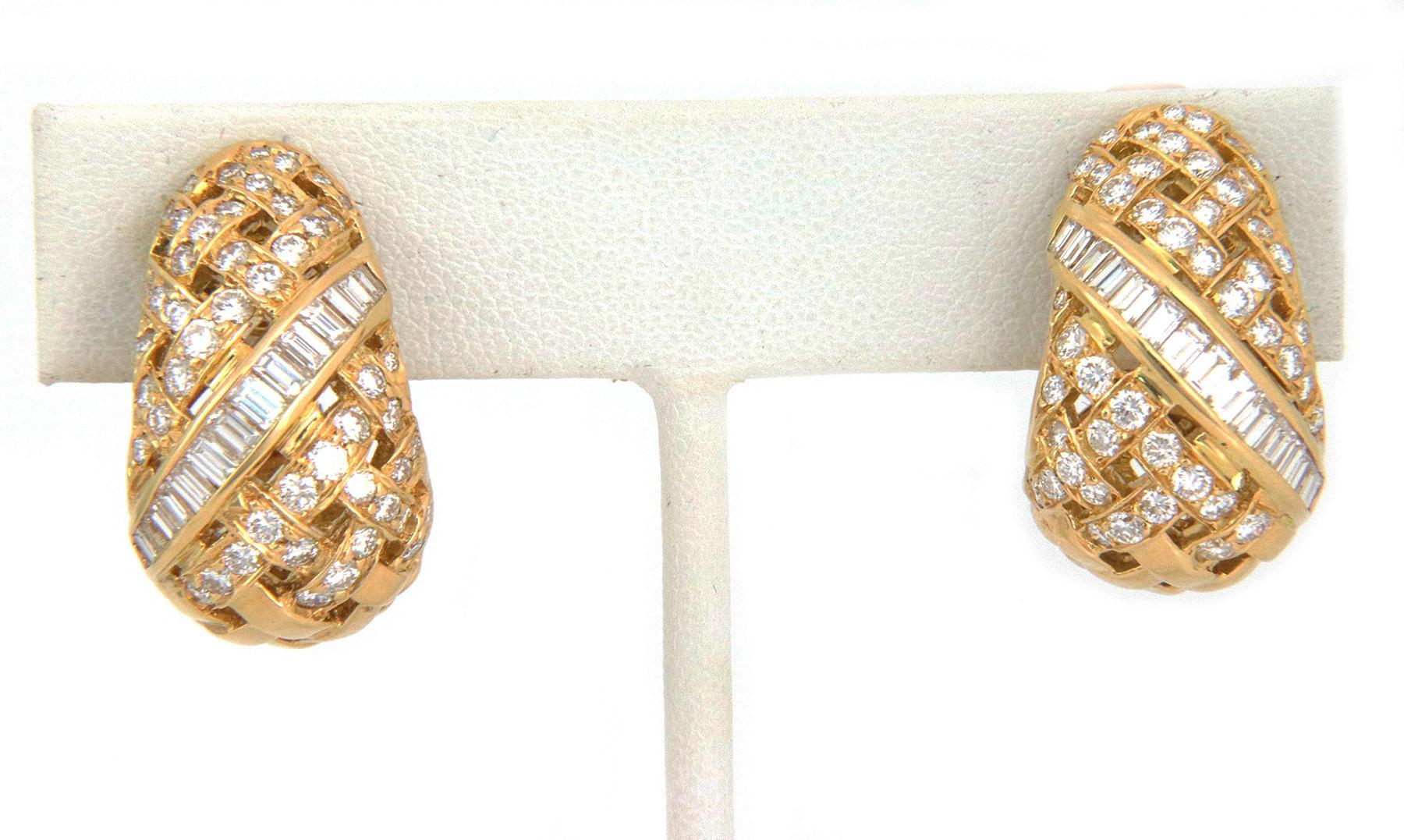 Tiffany & Co. Vannerie Collection pair of huggies earrings are crafted from 18k yellow gold featuring a tapered dome bottom style with the basket weave design, the top and lower part of on the front has round cut diamonds along the strips and the