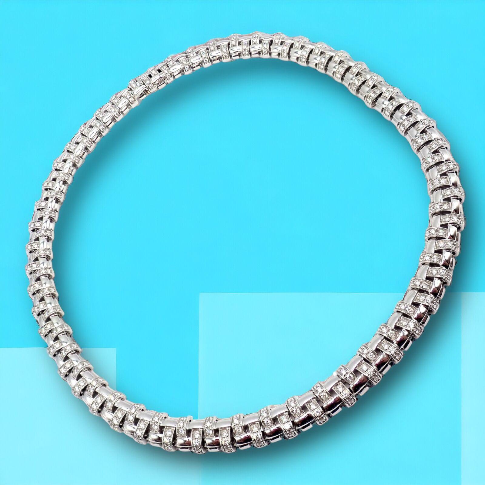 18k White Gold Vannerie Basket Weave Diamond Choker Necklace by Tiffany & Co.
This authentic Tiffany & Co. Vannerie necklace is a masterpiece of luxury and intricate design. Crafted from 18k white gold, it showcases a stunning basket weave pattern,
