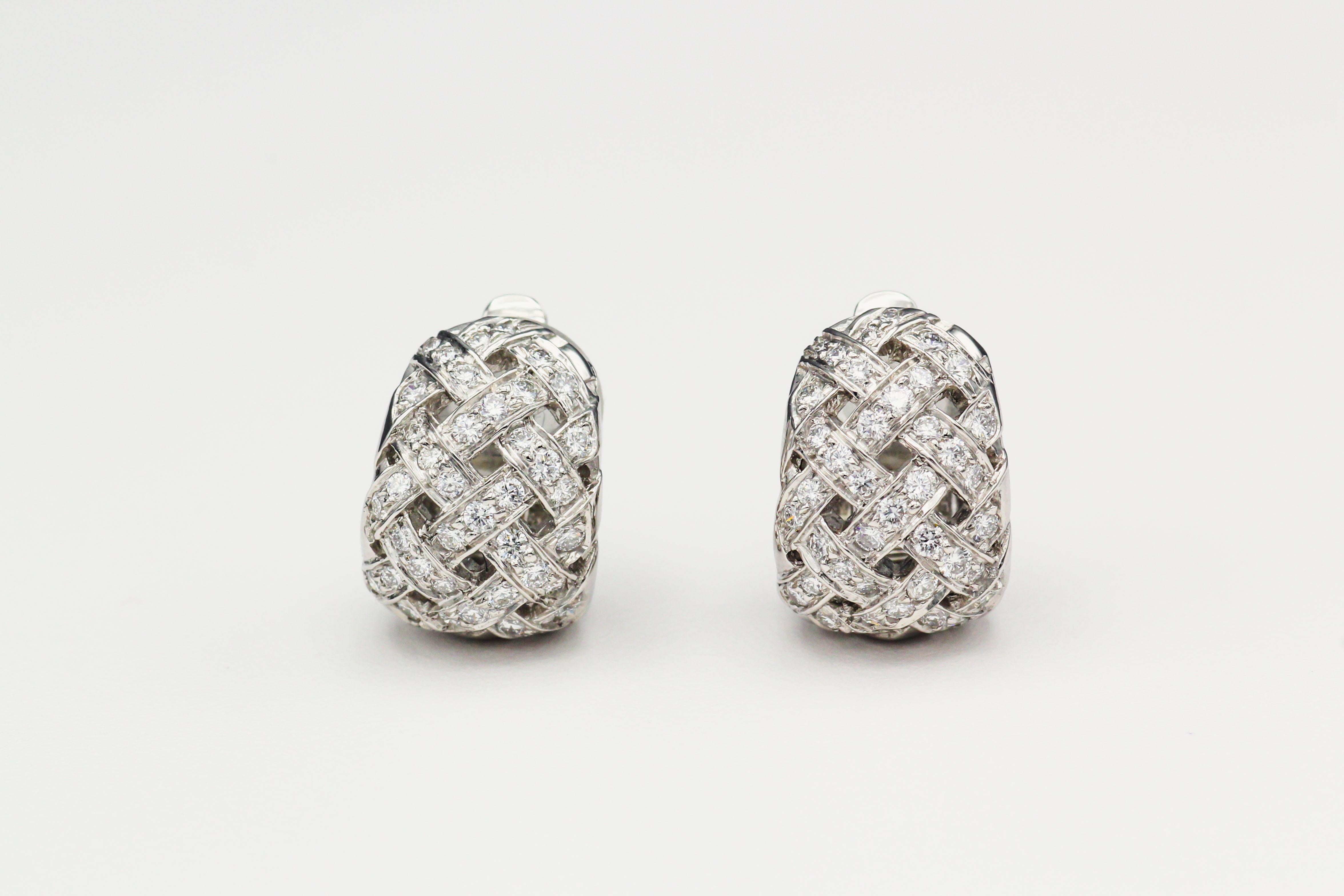 Step into a world of timeless elegance with these exquisite vintage Tiffany & Co. Vannerie Diamond and Platinum Basketweave Huggie Earrings. Meticulously crafted, these earrings are a testament to Tiffany & Co.'s legacy of creating exceptional