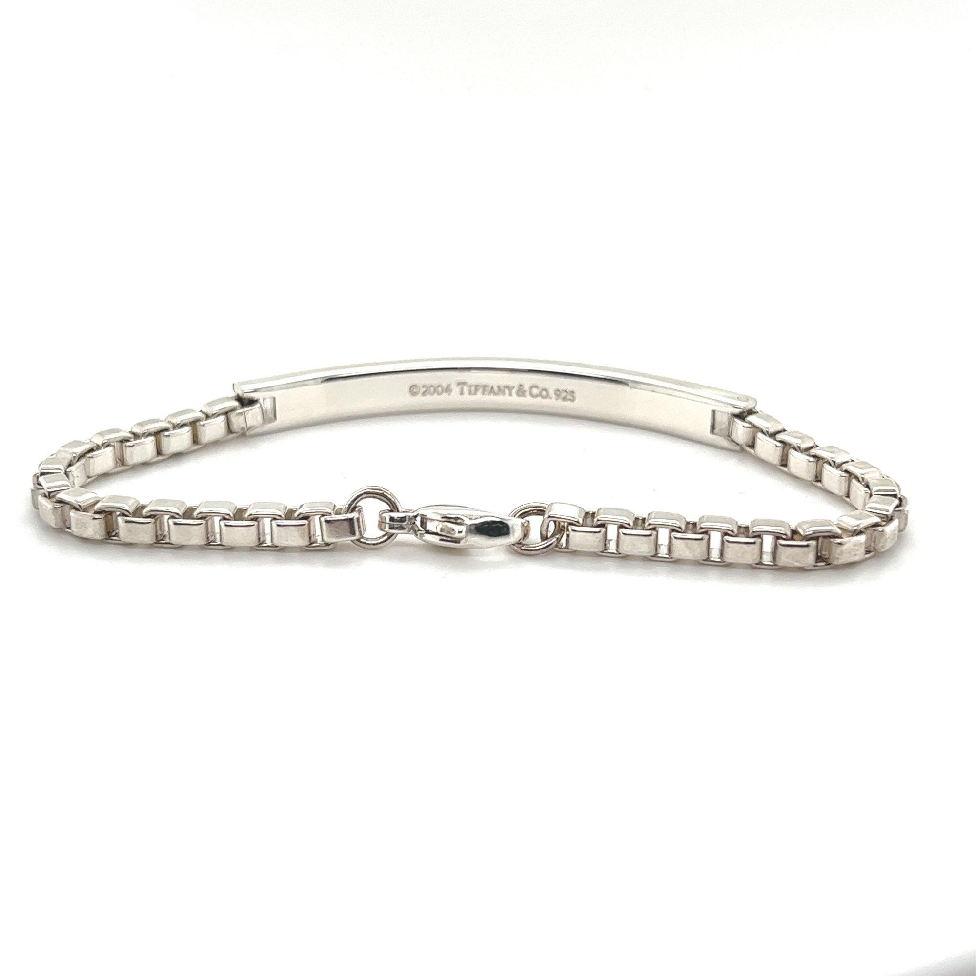 Inspired by ancient Roman arches, Tiffany & Co. Venetian link I.D. Men's bracelet is designed in sterling silver 925. This bracelet features stamped center bar with box links chain and lobster lock. Bracelet Length: 7.5 Inches, Width: 5.4mm. No box