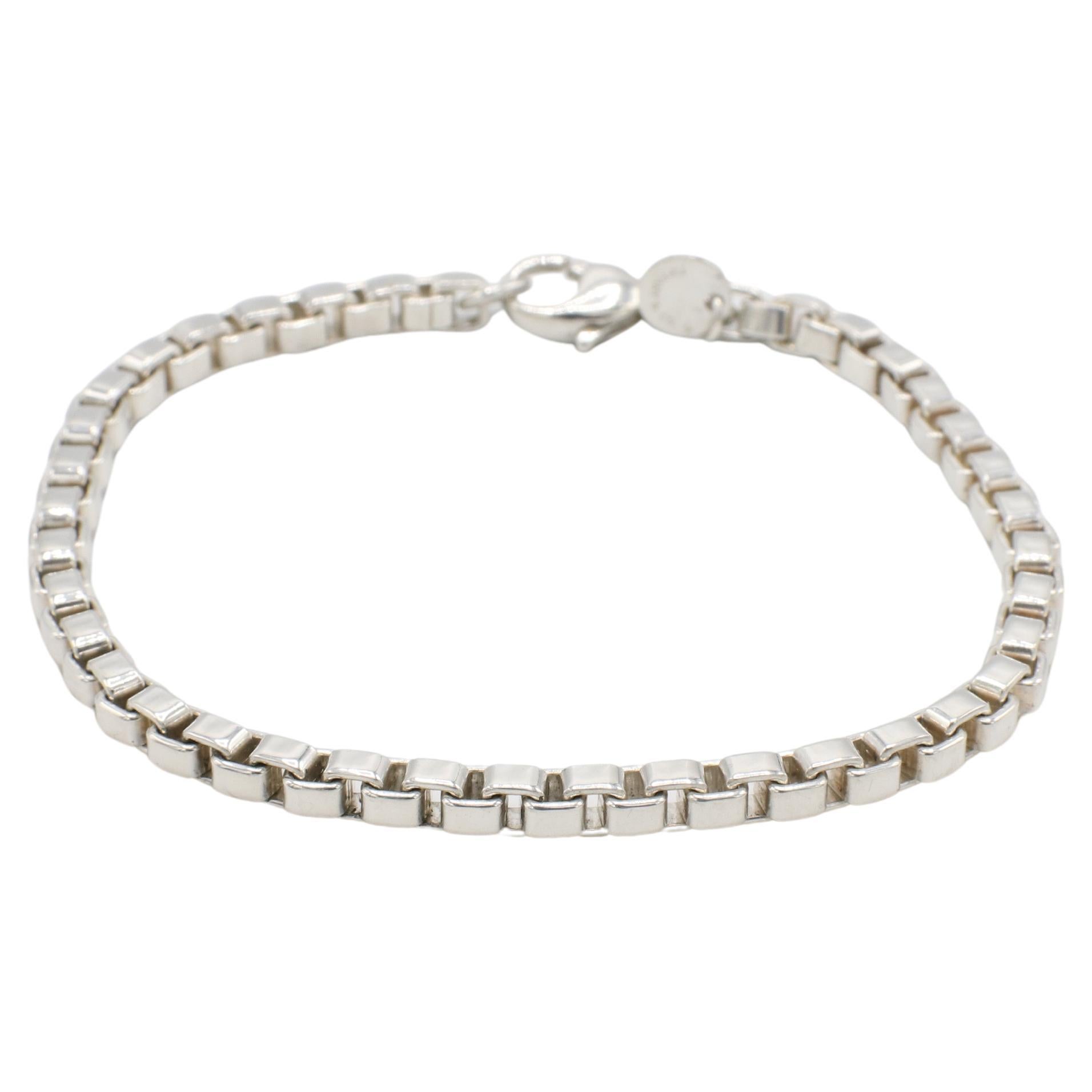 Tiffany & Co. Venetian Sterling Silver Box Link Bracelet 
Metal: Sterling silver 925
Weight: 15.57 grams
Length: 7.5 inches
Width: 4mm
Retail: $475 USD
Signed: Tiffany & Co. 925
