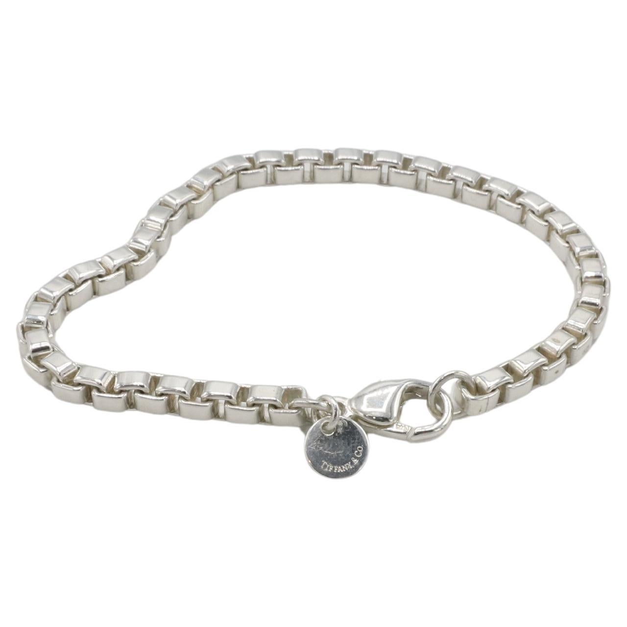 Tiffany & Co. Venetian Sterling Silver Box Link Chain Bracelet 6.25 Inches
Metal: Sterling silver 925
Weight: 13.6 grams
Length: 6.25 inches (clasped)
Width: 4mm
Retail: $500 USD
AT F35000820