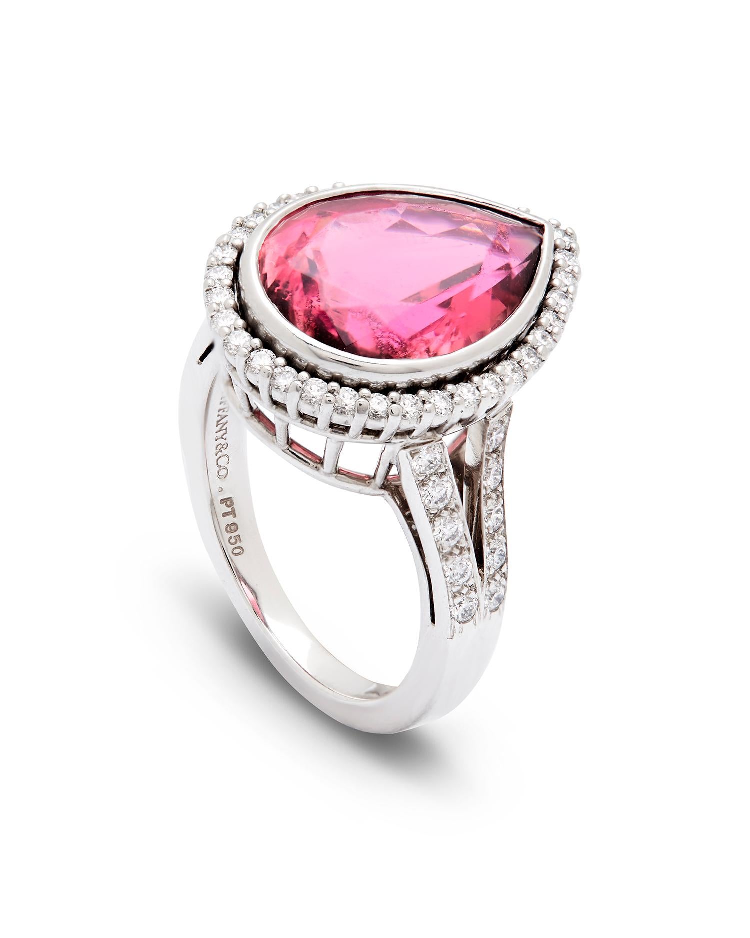 Tiffany & Co Rubellite and Diamond ring. 

Set in platinum, with a large pear cut rubellite tourmaline of approximately 6.15 carats 

With a Halo border of 53 round brilliant cut Diamond surrounding the central principal Gem, and running down