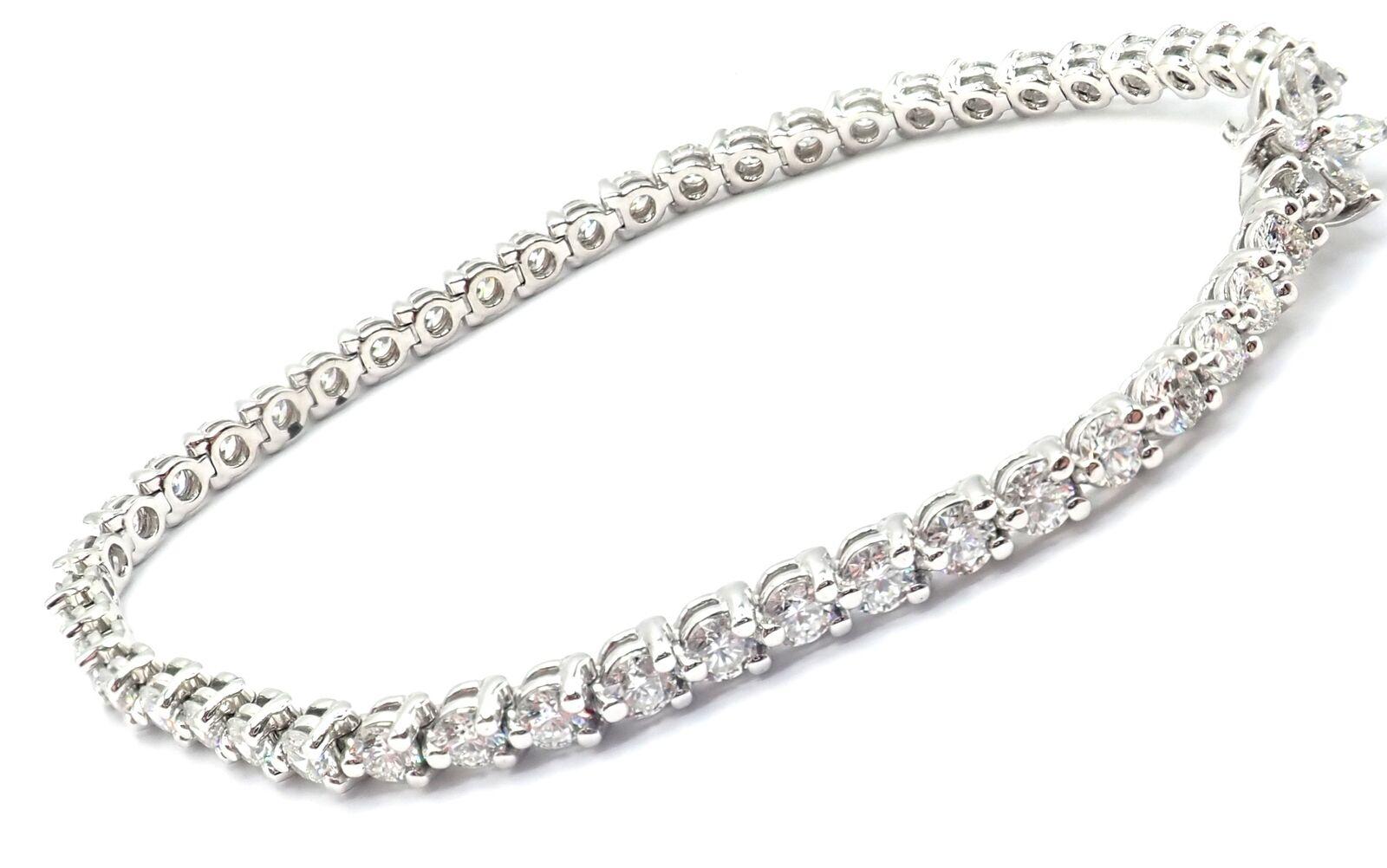 Platinum Diamond Line Tennis Bracelet by Tiffany & Co from Victoria collection.
With 47 round brilliant cut diamonds VS1 clarity, E color total weight approx. 4.24ct
4 marque cut diamonds .24ct
This bracelet comes with Tiffany & Co box.
The retail