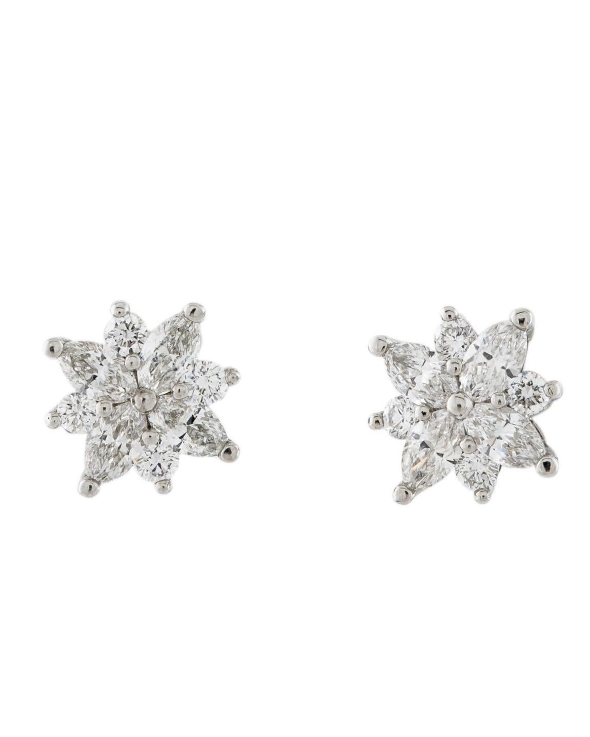 Tiffany Co Victoria cluster earrings , studs
950 PT 
Diamonds approximately weighing 0.70 total 
An amazing pre-owned pair of earrings , discontinued model 
Great investment value 
Comes with: original box  

 