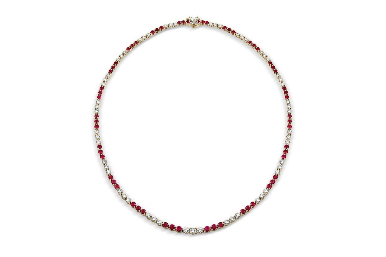 Gorgeous Tiffany & Co. graduated ruby, diamond and 18k yellow gold necklace from the Victoria Collection. There are approximately 6.75cts of round faceted rubies and approximately 5.7cttw of round brilliant and marquise cut diamonds.