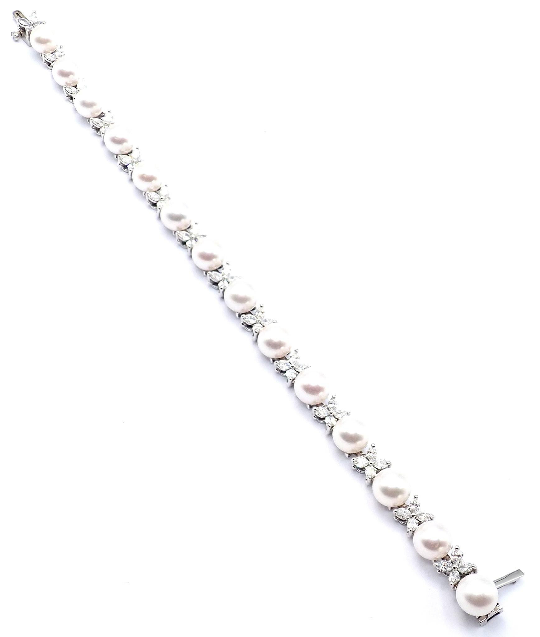 This exquisite Tiffany & Co Victoria tennis bracelet is meticulously crafted in platinum, featuring 1.94 carats of round brilliant diamonds and Akoya cultured pearls 6.5-7mm in a seamless line. 
Symbolizing timeless elegance, the refined design